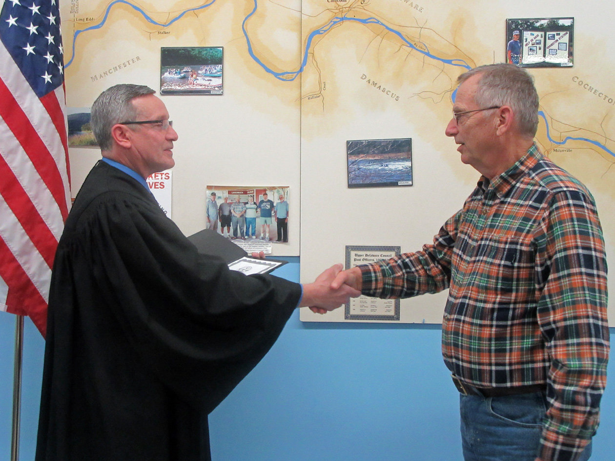 Newly-elected Upper Delaware Council Chairperson Jeffrey R. Dexter, right, of Damascus Township is shown being sworn in last year by the Hon. Steven Sauer, Town Justice for the Town of Cochecton, at the Feb. 6, 2020 UDC meeting.